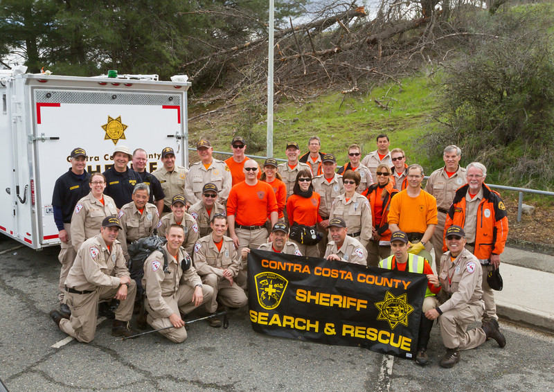 Photo of Emergency Services Individuals in front of banner