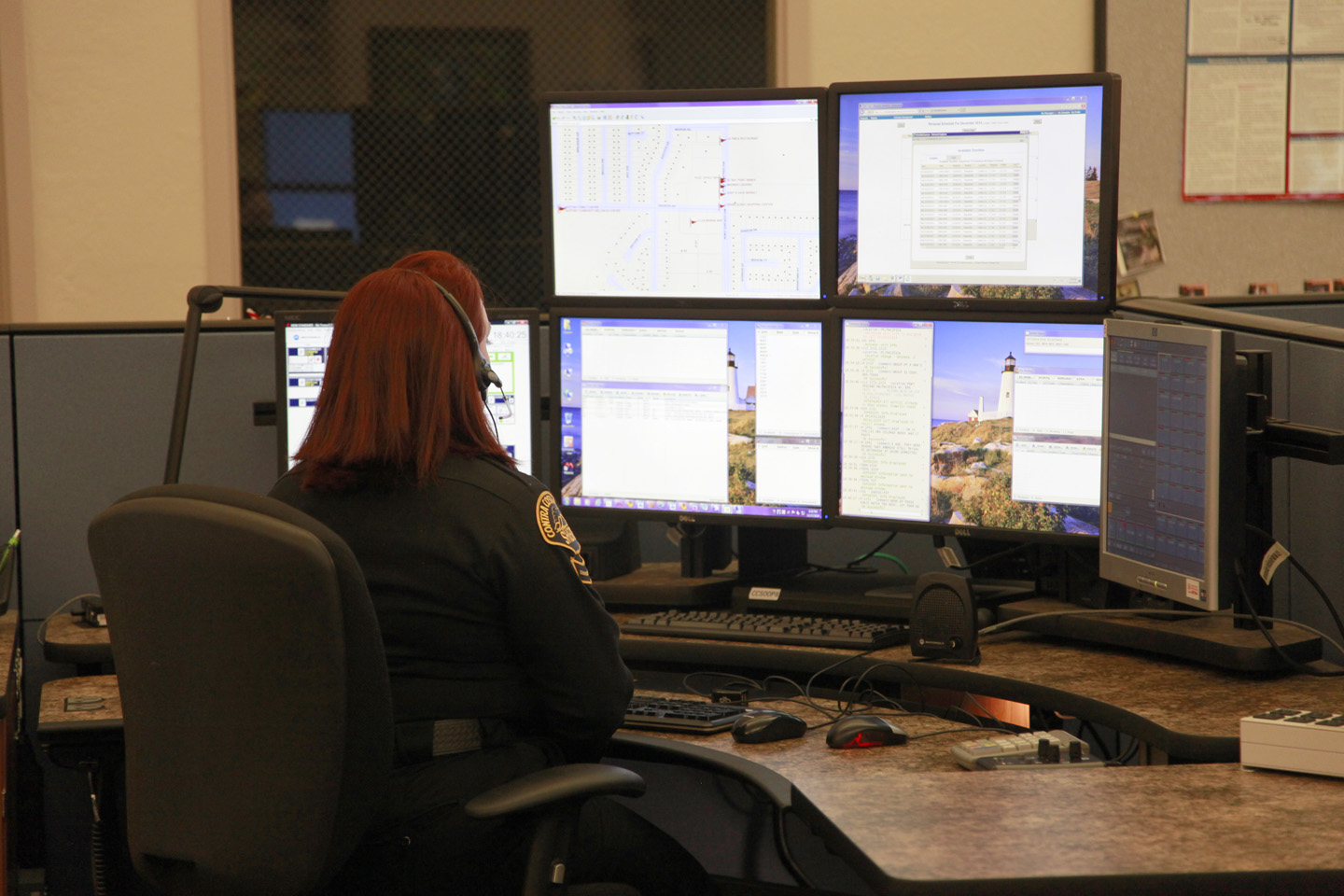 Photo of Communications Center staff on Computer