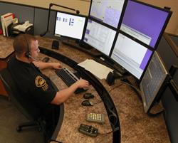 Photo of Communications Center staff on Computer