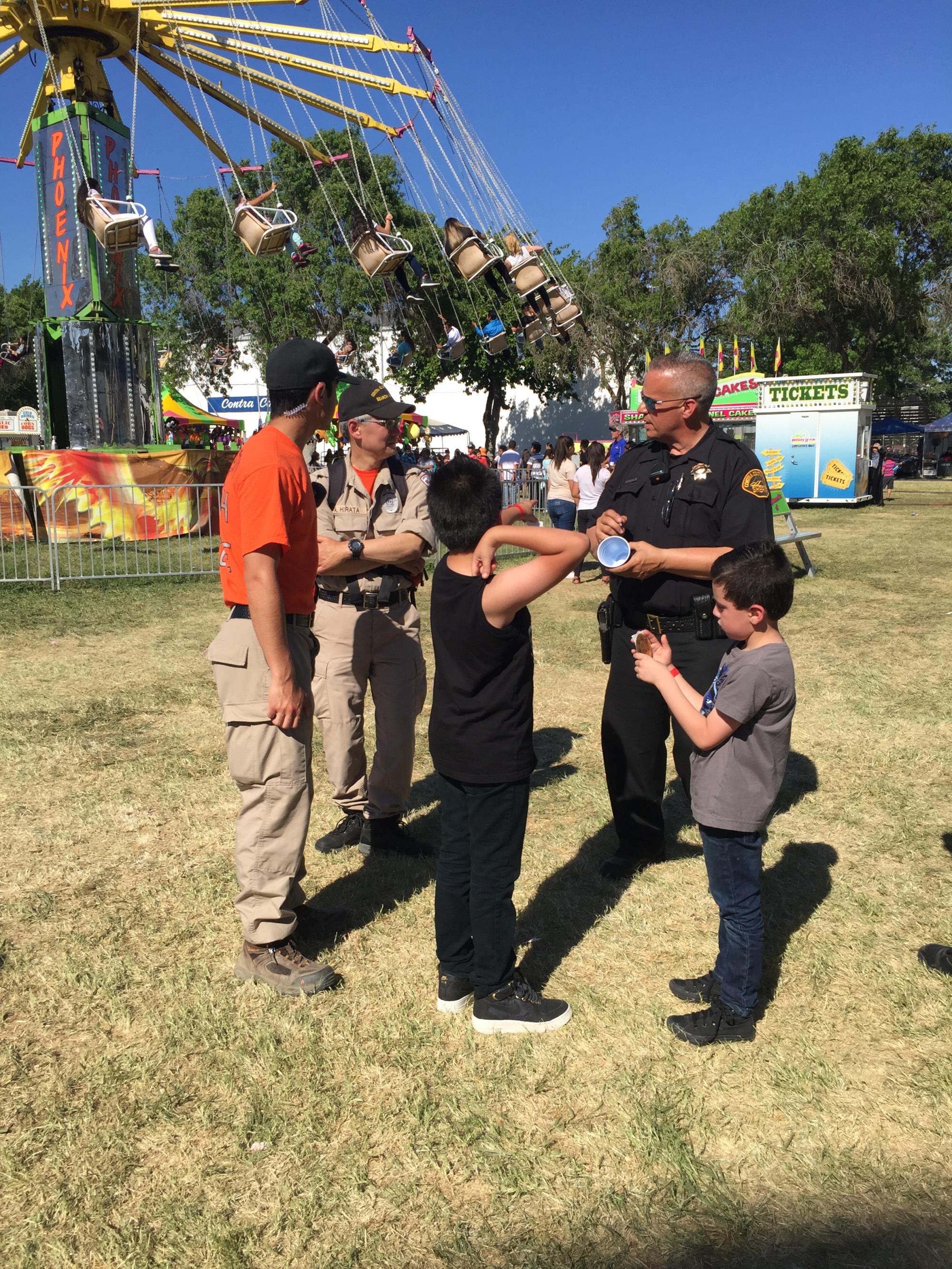 Photo of Officer interacting with family