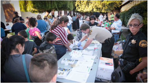 Photo of Officers interacting with Civilians