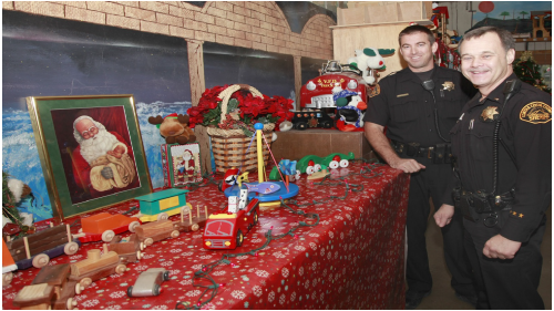 Photo of Officers smiling at a table with holiday decor