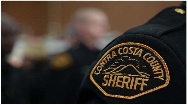 Photo of Sheriff's Badge on an officers shoulder