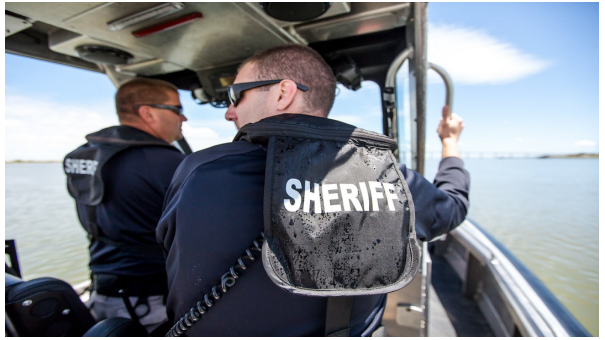 Photo of Marine Patrol Officers on a boat