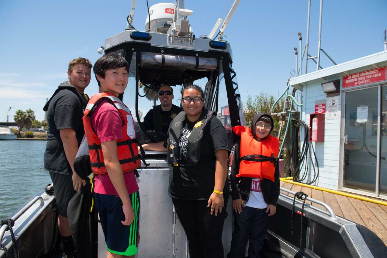 Photo of people on marine patrol boat