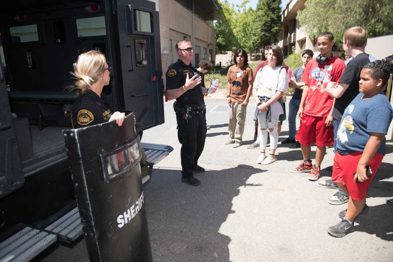 Photo of SWAT meeting with people